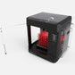 The MAKERBOT SKETCH SINGLE 3D PRINTER SETUP with a red honeycomb object inside.