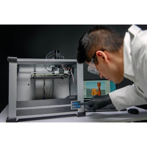 A scientist with his engineering laptop, programming the nano3Dprint A2200 3D Multi-material Electronics Printer